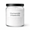 Niacinamide (Vitamin B3) by Organicsbyjumira — ultra-fine white cosmetic-grade powder with soft, silky micro-crystalline texture for brightening and skin-barrier formulations.