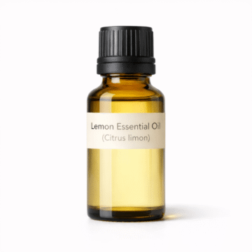 “Lemon Essential Oil by Organicsbyjumira — pale yellow clear citrus essential oil in an amber bottle, cosmetic-grade.”