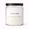 “Stearic Acid by Organicsbyjumira — white waxy cosmetic-grade flakes used as a thickener and stabilizer in creams and lotions.”