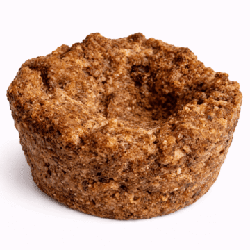 “African Black Soap by Organicsbyjumira — deep brown traditional soft soap pieces with natural crumbly texture for cleansing and skin-purifying formulations.”