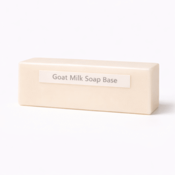 “Goat Milk Soap Base by Organicsbyjumira — creamy white opaque melt-and-pour soap chunks with smooth, firm texture for gentle skincare formulations.”
