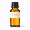 Cinnamon Essential Oil by Organicsbyjumira — warm golden aromatic essential oil with a spicy, rich scent in an amber bottle for skincare and aromatherapy formulations.