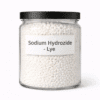 Sodium Hydroxide (Lye) by Organicsbyjumira — white solid cosmetic-grade pellets in a clear laboratory jar.