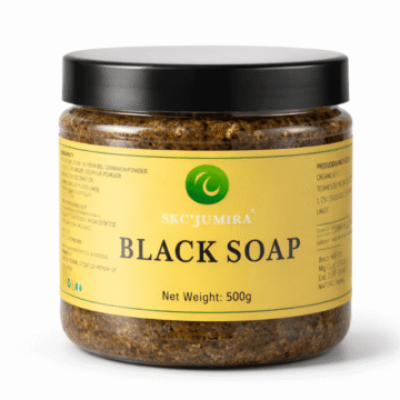 SKC'Jumira African Black Soap in a 500g clear jar with the lid placed beside it, showing the natural textured soap inside