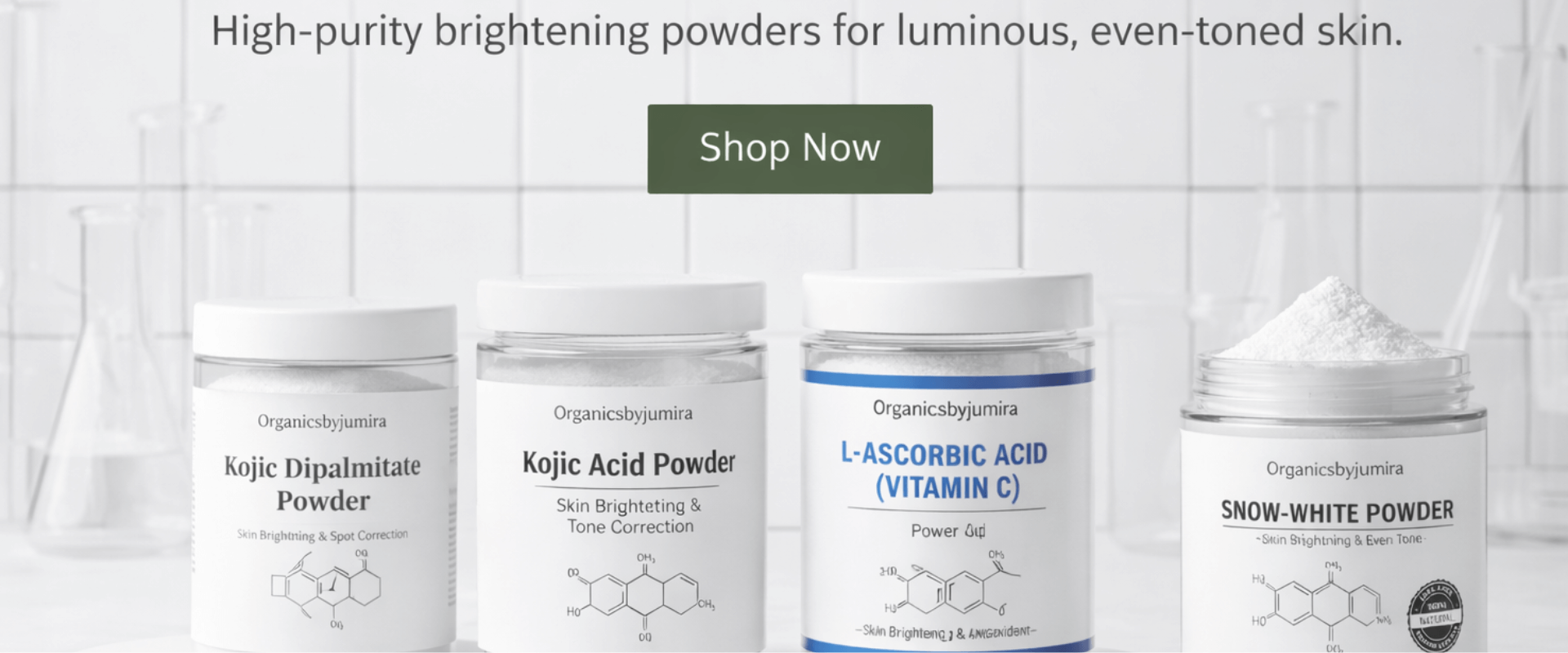 Organicsbyjumira brightening skincare ingredients including kojic acid powder, kojic dipalmitate, vitamin C powder, snow white powder, and giga white powder displayed in a clean laboratory-style setting.