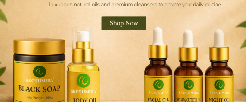 Luxury SKC’Jumira skincare products including African black soap, body oil, facial oil, hand and cuticle oil, and night oil displayed on a beige background with green botanical accents.
