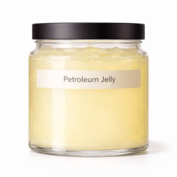 “Petroleum Jelly by Organicsbyjumira — smooth semi-solid cosmetic occlusive base in a clear wide-mouth jar for skincare formulation.”