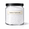 “Sodium Hydroxide (Lye) by Organicsbyjumira — white caustic pellets used for cold-process soap making and cosmetic formulation.”