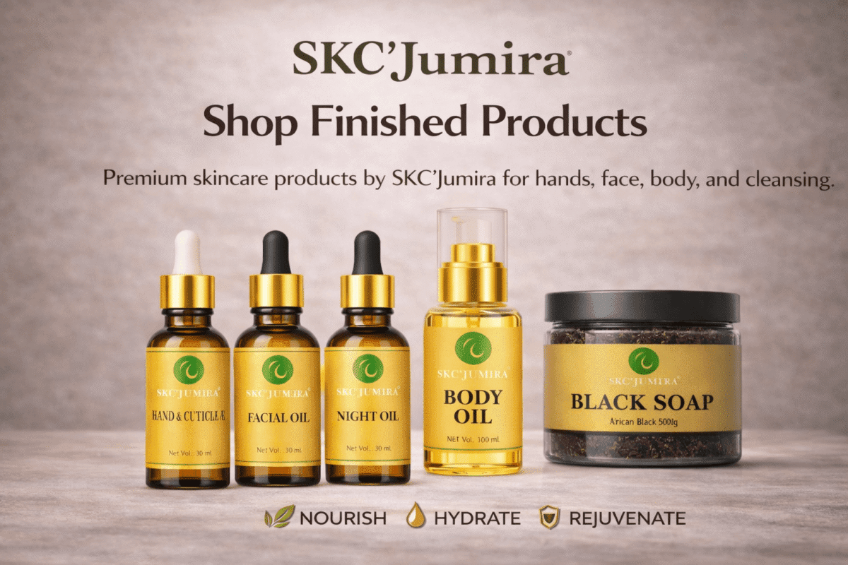 SKC’Jumira finished skincare products — hand and cuticle oil, facial oil, night oil, body oil, and African black soap displayed on a beige editorial beauty backdrop.